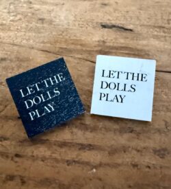 Let the Dolls Play badge